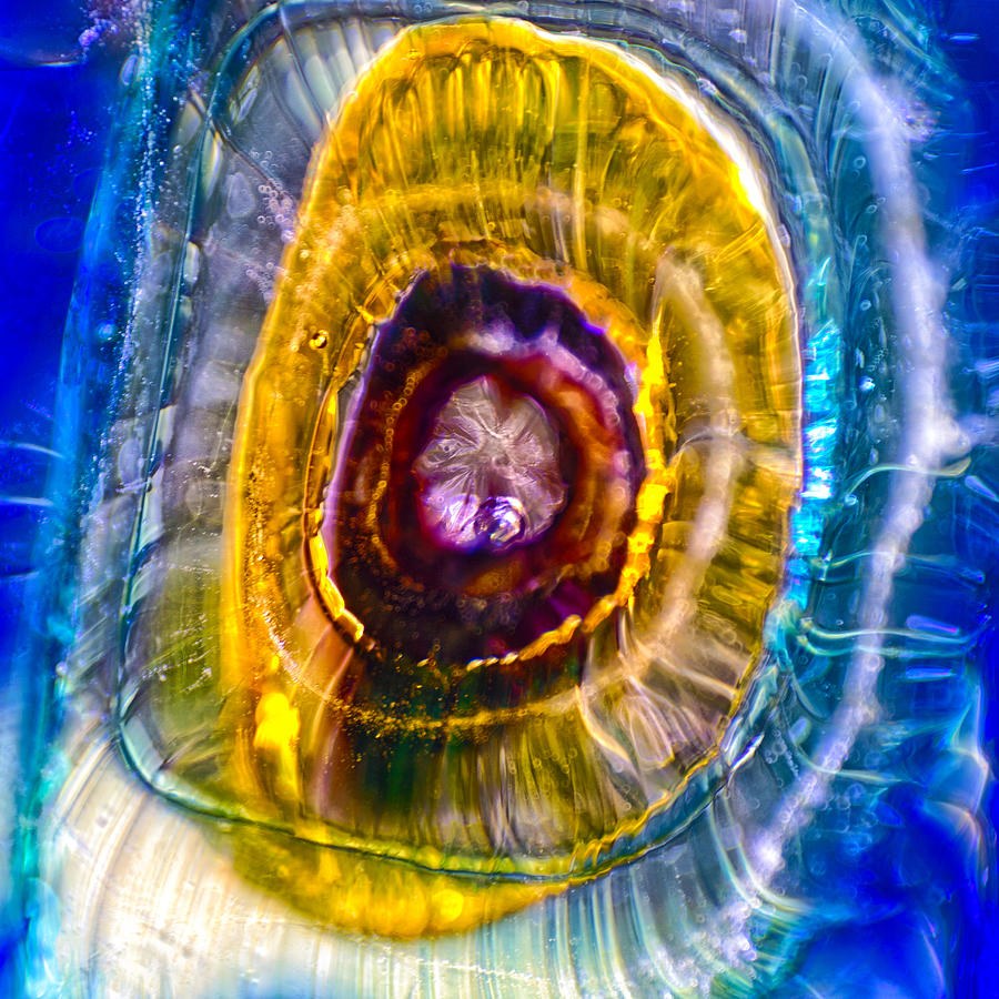 Golden Halo: Glowing Rings on Cobalt Blue by Omaste Witkowski